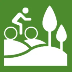 Weißes Radfahrersymbol auf grünem Grund zur Kennzeichnung von Radwegen bei Reckenstetten, Freystadt. Weißes Radfahrersymbol auf grünem Grund zur Kennzeichnung von Radwegen bei Reckenstetten, Freystadt.
